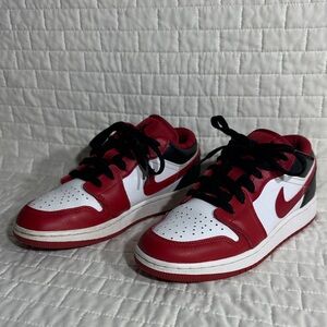 Nike Air Jordan 1 Low in the white, gym red, and black colorway